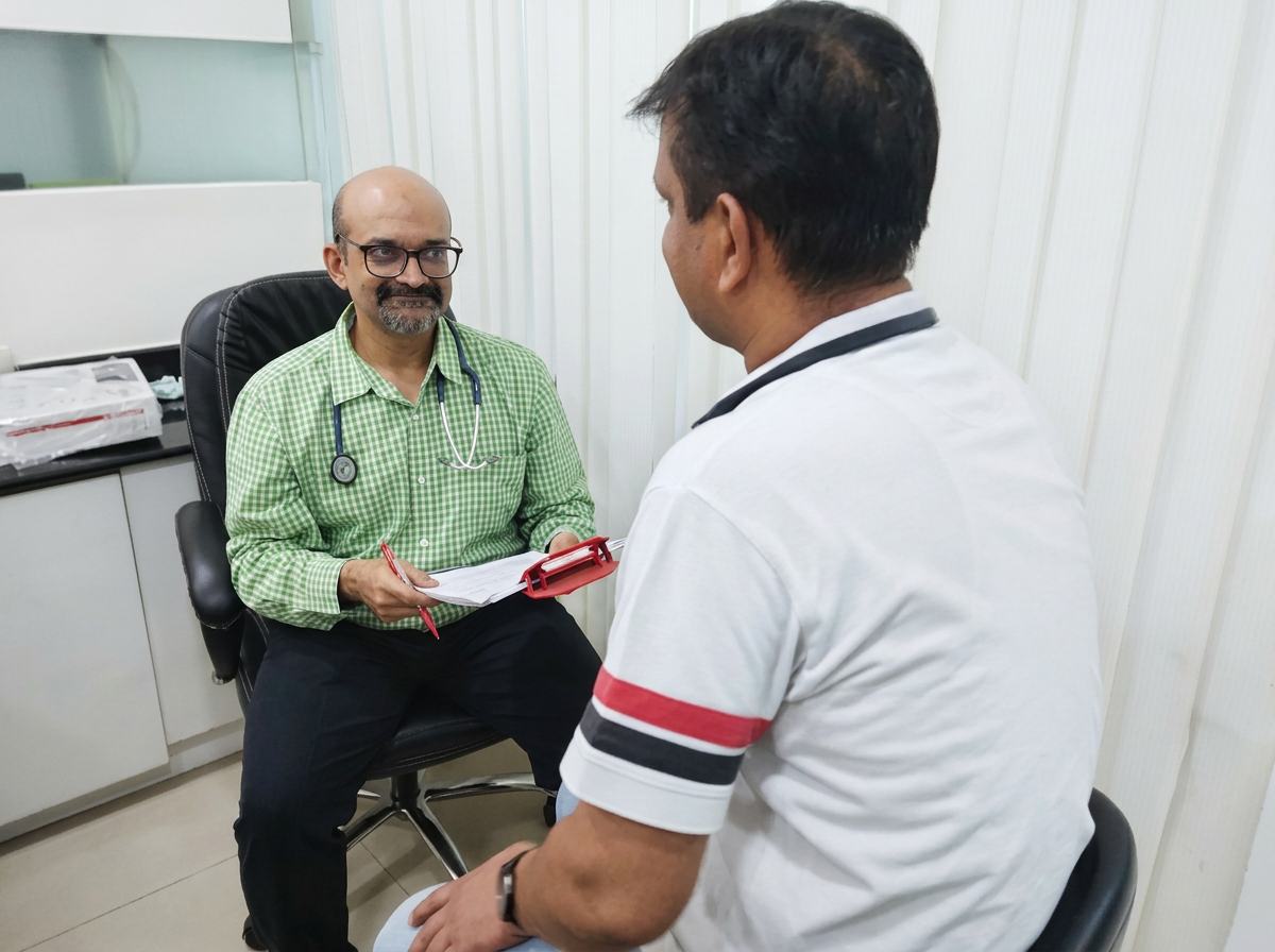 Dr. Brijmohan Arora consulting a patient at his diabetes clinic in Sector 7, Dwarka
